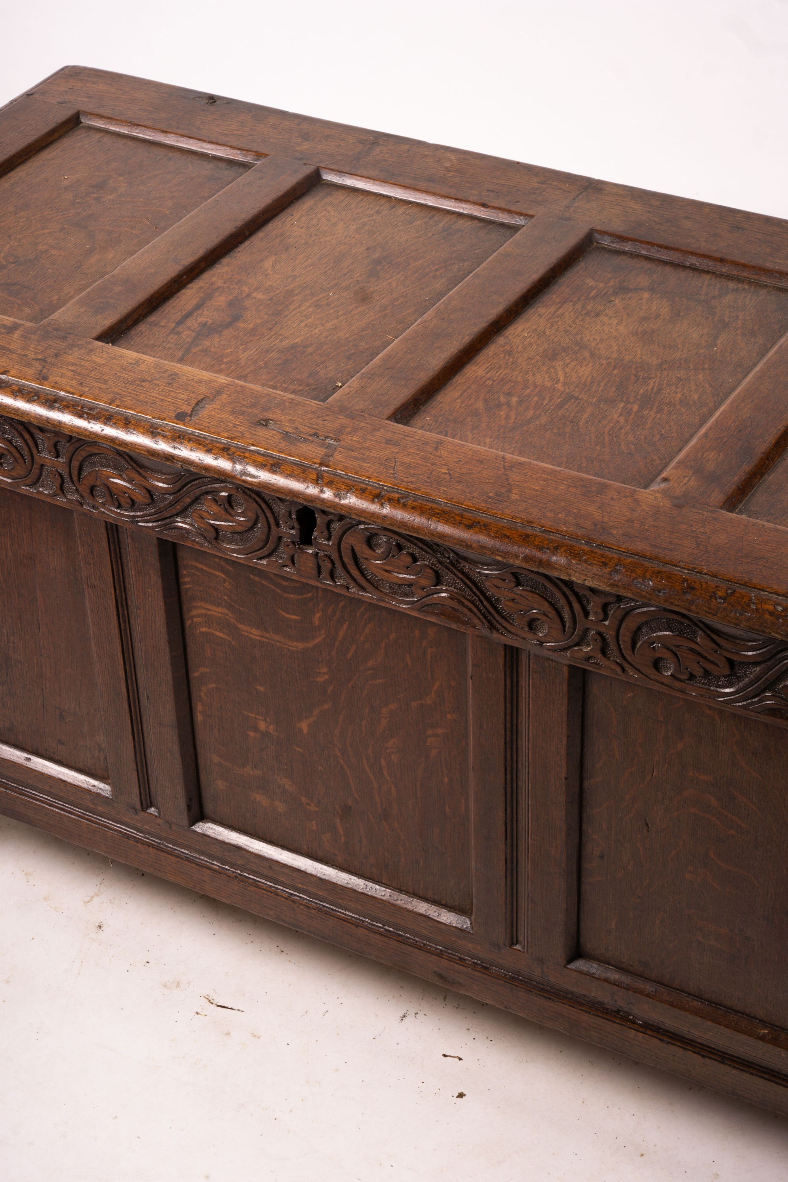 A 17th century panelled oak coffer, W.122cm D.55cm H.65cm